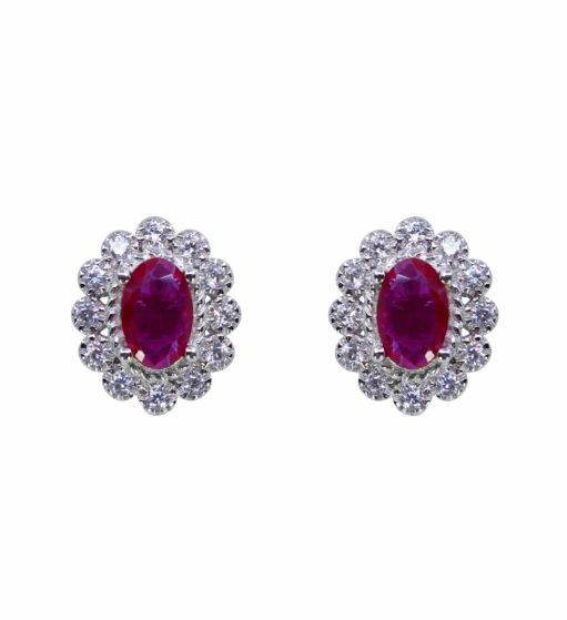 Rhodium plated sterling Silver stud earrings with Clear and Fuchsia cubic zirconia stones.

