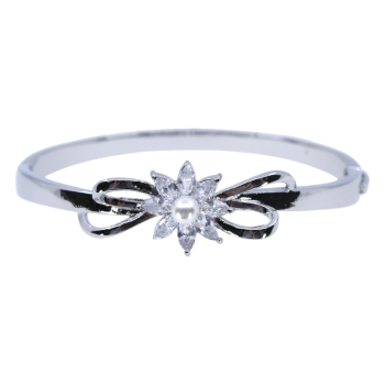 Gold or Rhodium colour plated floral design bangle with genuine Clear crystal stones and a imitation pearl.
