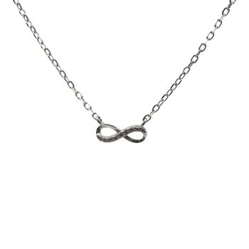 Rhodium plated sterling Silver infinity design necklace with Clear cubic zirconia stones.
