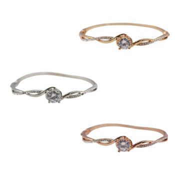 Ladies metal bangle with genuine crystal Clear stones and a centered Clear cubic zirconia stone.
