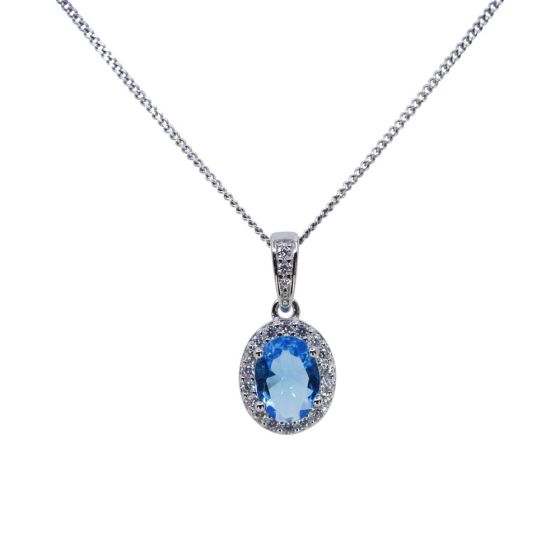 Rhodium plated sterling Silver oval pendant with Clear and Blue Topaz cubic zirconia stones.
