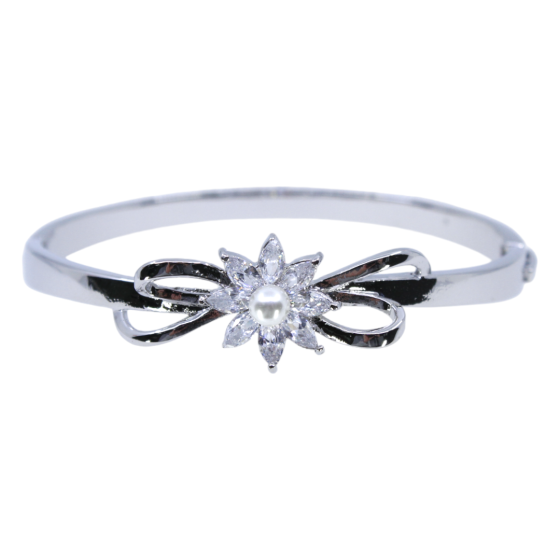 Gold or Rhodium colour plated floral design bangle with genuine Clear crystal stones and a imitation pearl.
