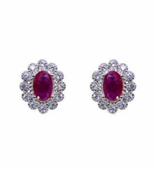 Rhodium plated sterling Silver stud earrings with Clear and Fuchsia cubic zirconia stones.

