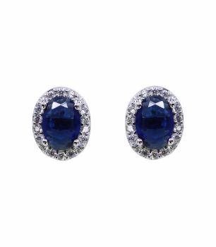 Rhodium plated sterling Silver oval stud earrings with Clear and Sapphire cubic zirconia stones.

