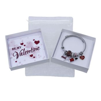 Boxed valentines day gift set includes a Rhodium colour plated lipstick design charm bangle decorated with coloured enamelling, a cream organza drawstring bag and a pearlised leatherette gift box with a sentimental message inside.