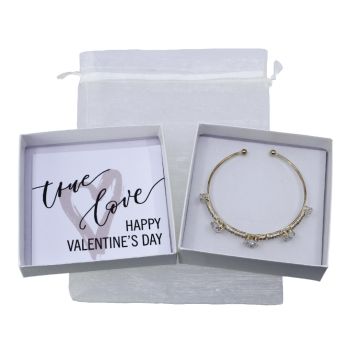 Boxed valentines day bangle gift set.
Set includes a Gold colour plated bangle with heart shaped genuine Clear crystal stones.
