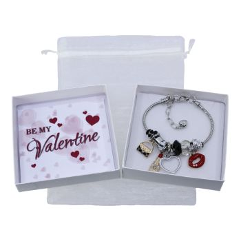 Boxed valentines day charm bracelet gift set.
Set includes a Rhodium colour plated, two tone lipstick, heart and lips design charm bracelet decorated with coloured enamelling.
