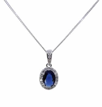 Rhodium plated sterling Silver oval pendant with Clear and Sapphire cubic zirconia stones.
