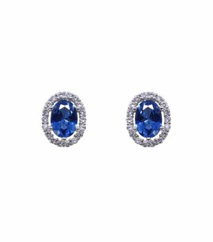 Rhodium plated sterling silver oval stud earrings with Clear and light Sapphire cubic zirconia stones.
