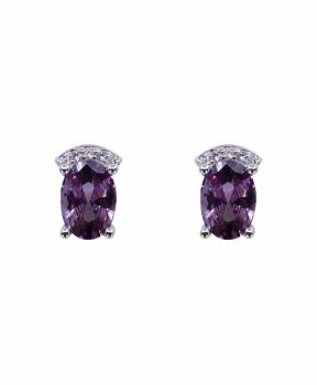 Rhodium plated sterling silver stud earrings with Clear and Amethyst cubic zirconia stones.