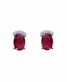 Rhodium plated sterling silver stud earrings with Clear and Rhodolite cubic zirconia stones.