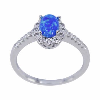Rhodium plated sterling Silver ring with Clear cubic zirconia and a synthetic Blue opal Stone.