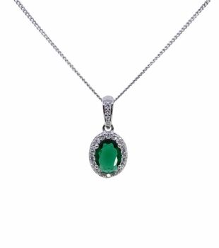 Rhodium plated sterling oval pendant with Clear and Emerald cubic zirconia stones.

