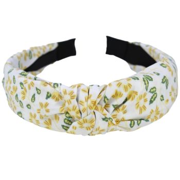 Wide satin covered head band decorated with a floral print fabric and centred knot alice band
