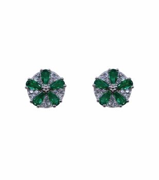 Rhodium plated sterling Silver flower design stud earrings with Clear and Emerald cubic zirconia stones.
