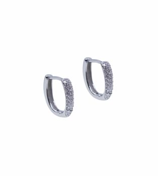 Rhodium plated sterling Silver hinged huggie earrings with Clear cubic zirconia stones.
