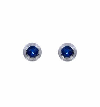 Rhodium plated sterling Silver stud earrings with Blue topaz cubic zirconia stones.
