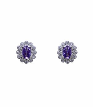 Rhodium plated sterling Silver stud earrings with Clear and Amethyst cubic zirconia stones.