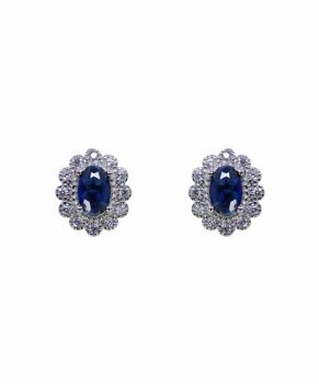 Rhodium plated sterling Silver stud earrings with Clear and Sapphire cubic zirconia stones.