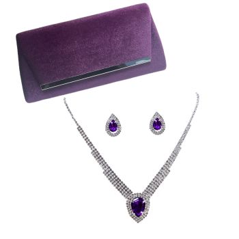 Purple Velvet evening bag with silver colour plated trim .

The evening bag has a magnetic fastner and a long rhodium plated chain handle .

We have teamed up this lovley evening bag with a matching diamante set with genuine crystal stones. Set is sui