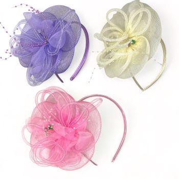 Ladies Fascinators with seed pearls and real glass beads .

Available in Baby Pink Lilac and Cream.

Sold as a pack of 3 per colour or 4 assorted .

Size of fascinator approx 17 x17 cm