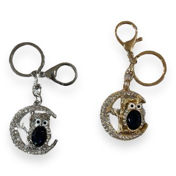 Owl in the moon bag charm embeleshed with genuine crystal and glass stones.

Available in Gold or Rhodium colour plating .

sold as a pack of 3 per colour or 4 assorted .

size approx .Owl 5 x4 cm ,Total size 11 cm.