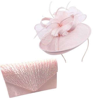 Beautiful quality  Baby Pink Ladies fascinator with feather and net trim.

Fascinator can be worn on a metal satin covered headband or on a concord clip.

Fascinator has been teamed up with a beautiful satin pleated evening bag trimmed with ab crystal